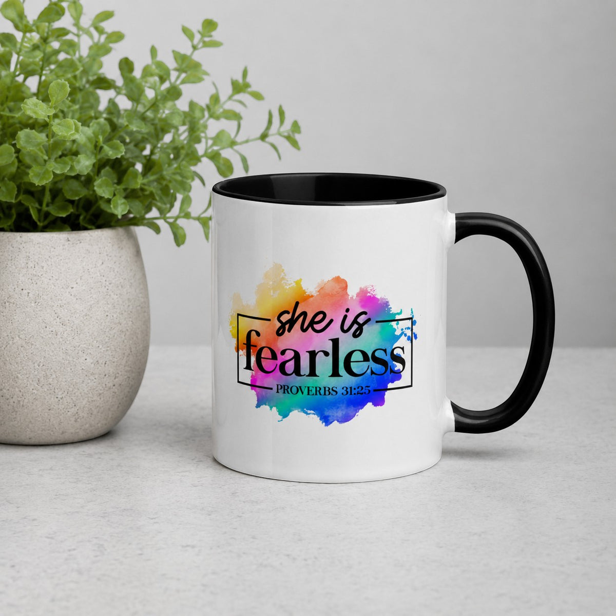 Brewtiful Sips two-tone ceramic mug featuring She Is Fearless Proverbs 31:25 text on a colorful watercolor splash.