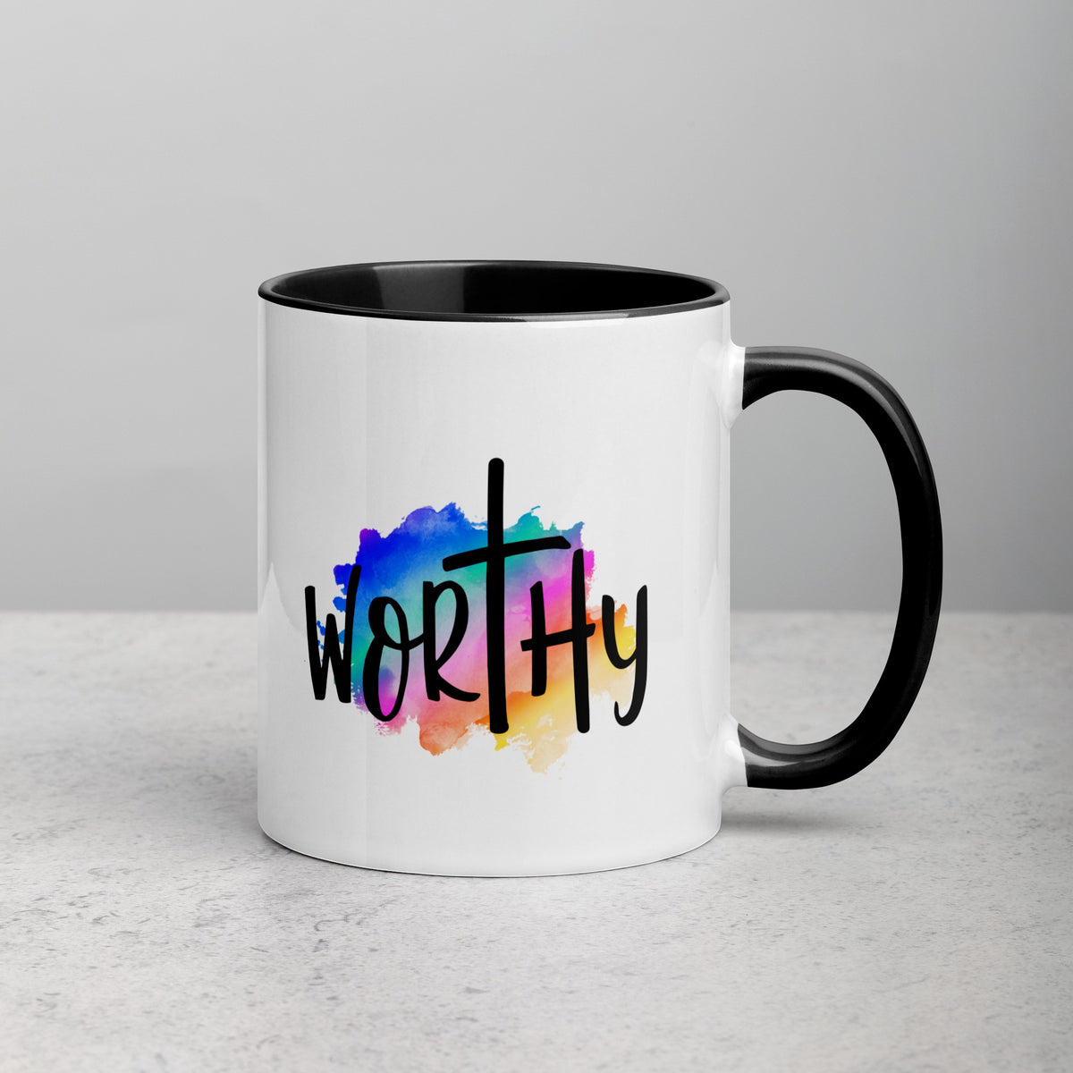 Brewtiful Sips 11oz ceramic mug with a black handle and rim featuring a colorful watercolor cross and Worthy text.